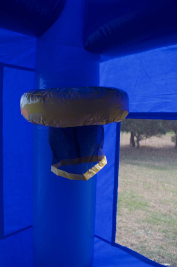 Close of up blue jumping castle basketball hoop