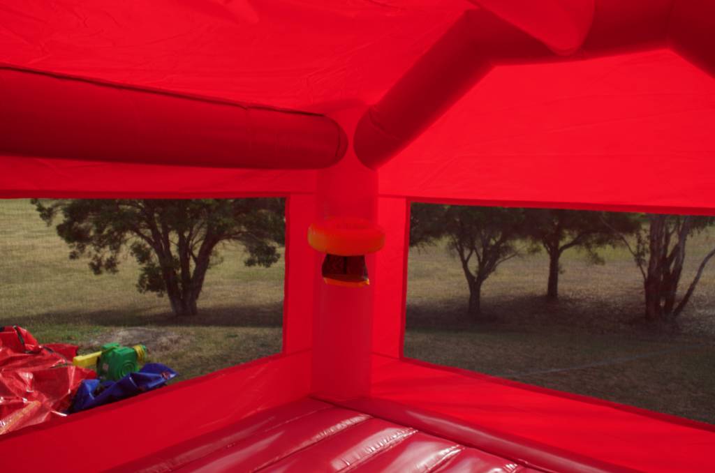 Inside of pink jumping castle with basketball hoop