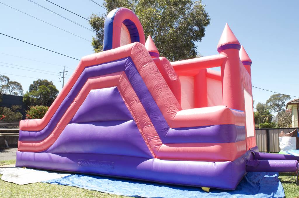 Disney Princess jumping castle with slide from the side