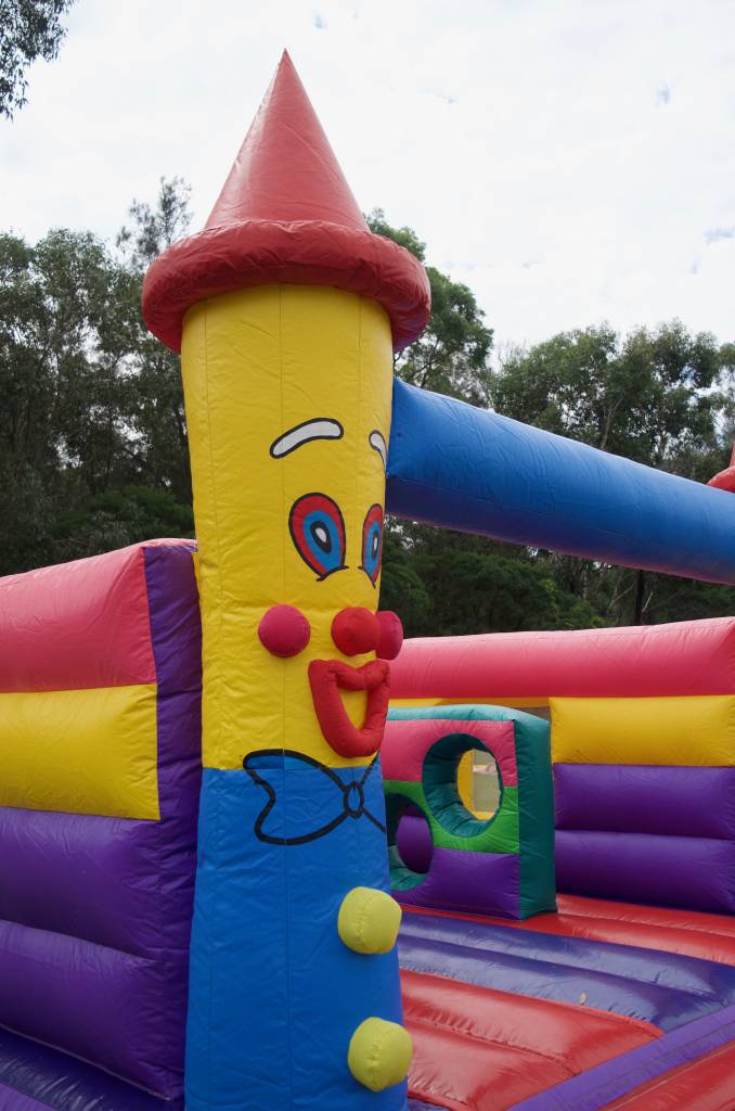 Close up of clown jumping castle
