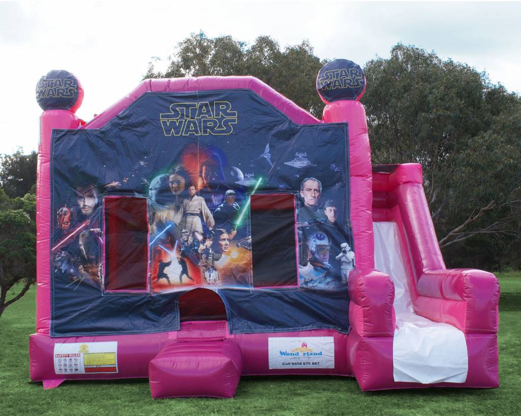 Giant pink Star Wars jumping castle with slide