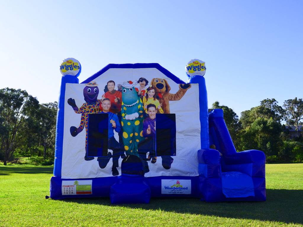 Blue Wiggles jumping castle with slide to the right